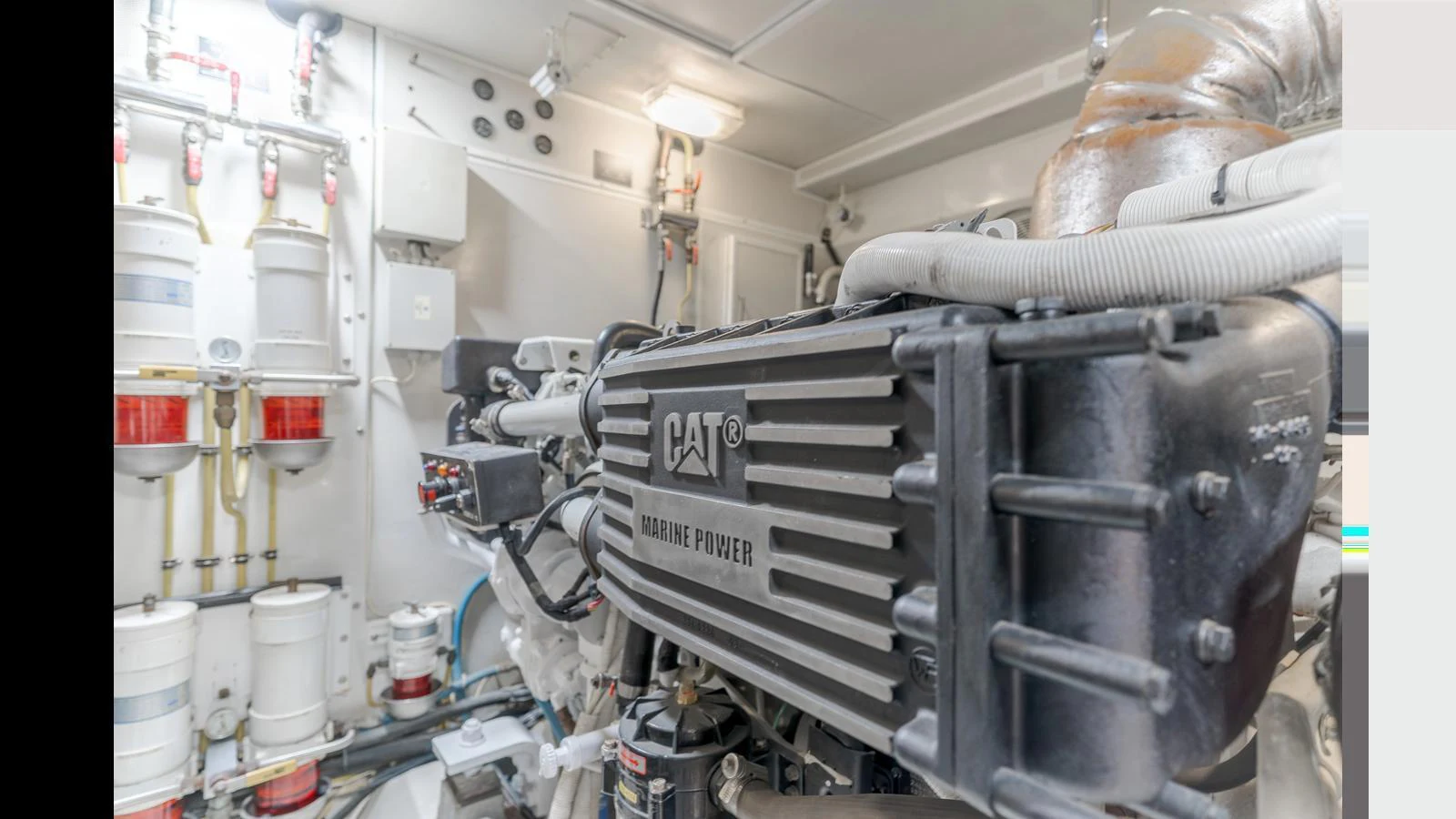 The image showcases the engine room with a focus on the powerful marine engine. aboard SEAQUEL Yacht for Sale