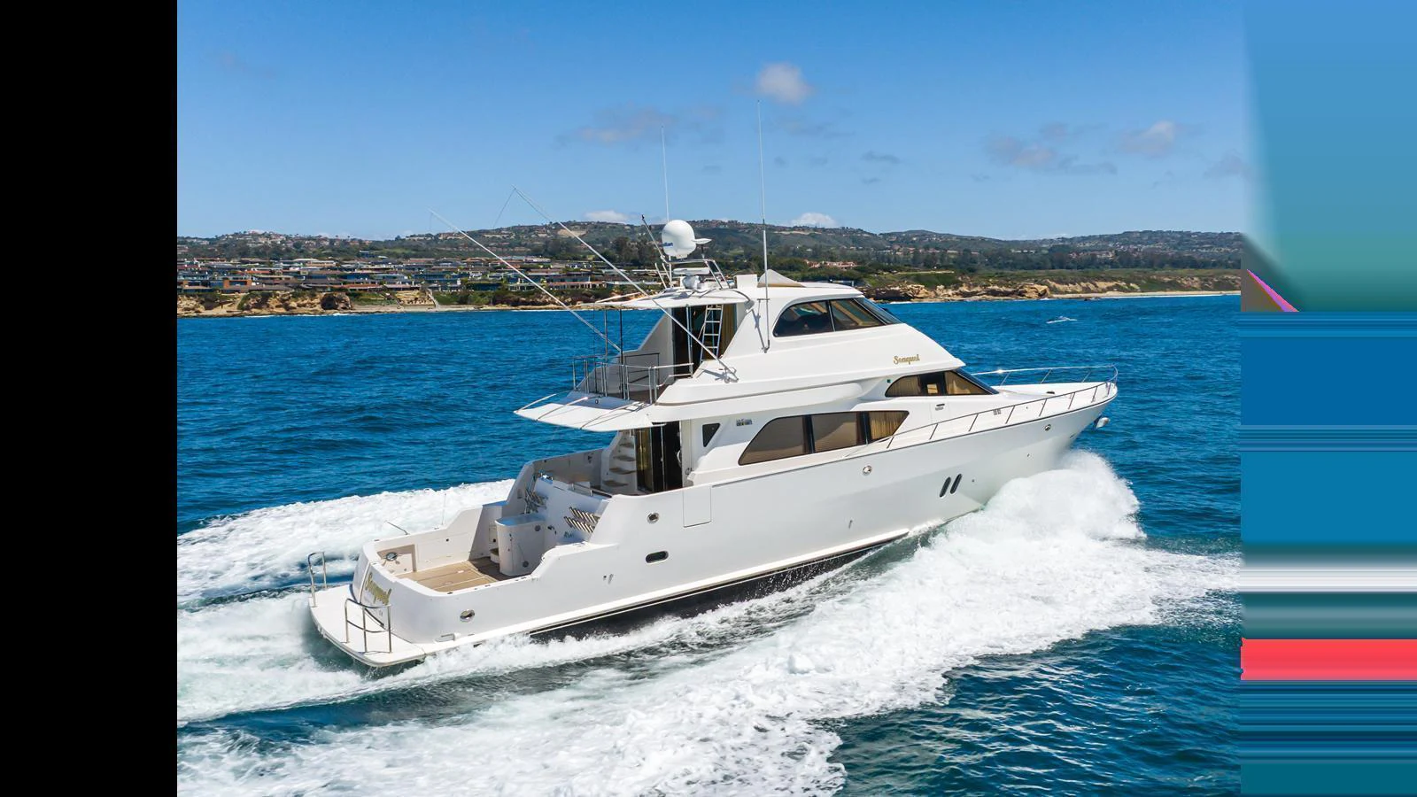 A sleek white yacht cruises through clear blue waters on a sunny day. aboard SEAQUEL Yacht for Sale