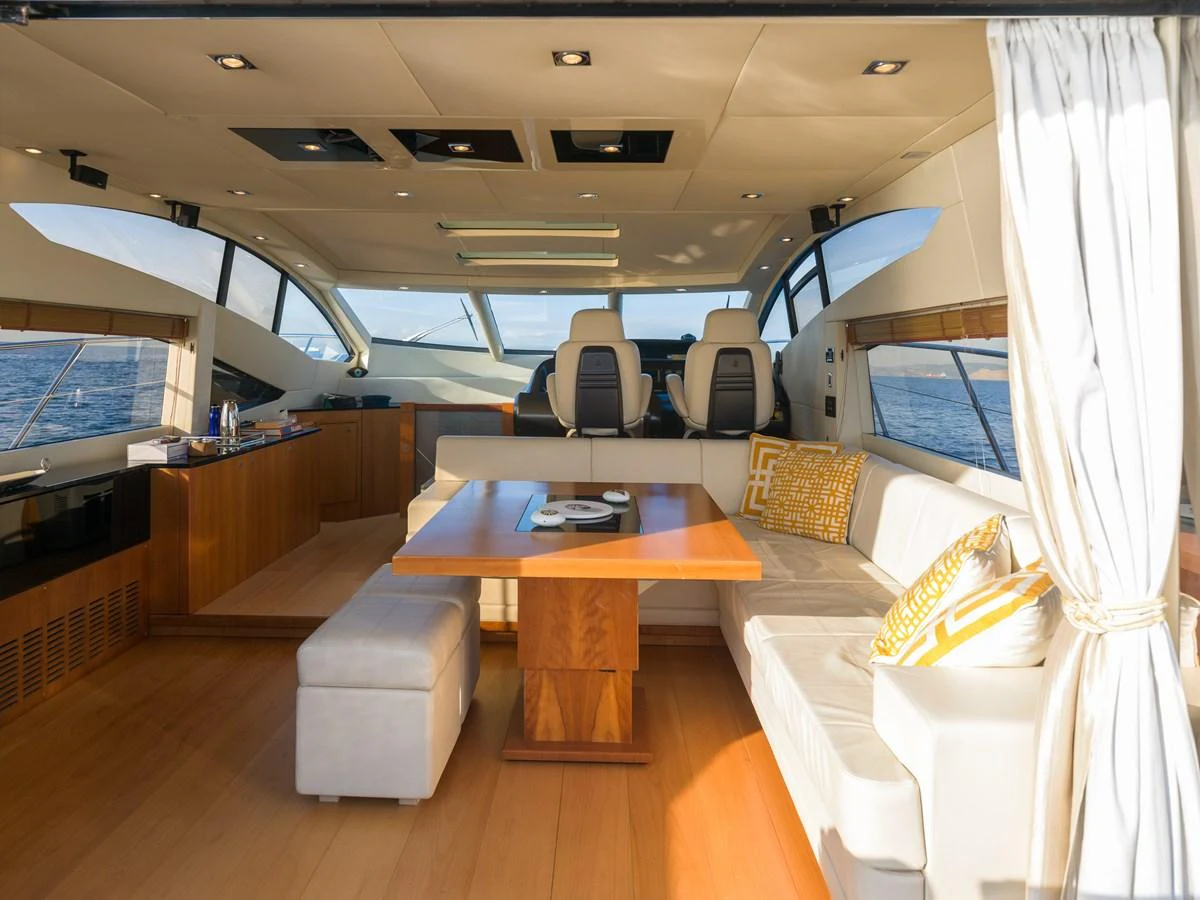 The salon offers a spacious and elegant seating area with panoramic windows and luxurious furnishings. aboard M/Y MIEL Yacht for Sale