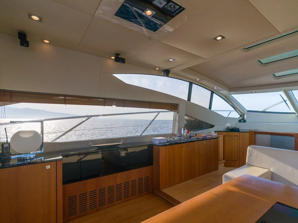 The salon offers a spacious and well-lit area with panoramic views of the sea. aboard M/Y MIEL Yacht for Sale