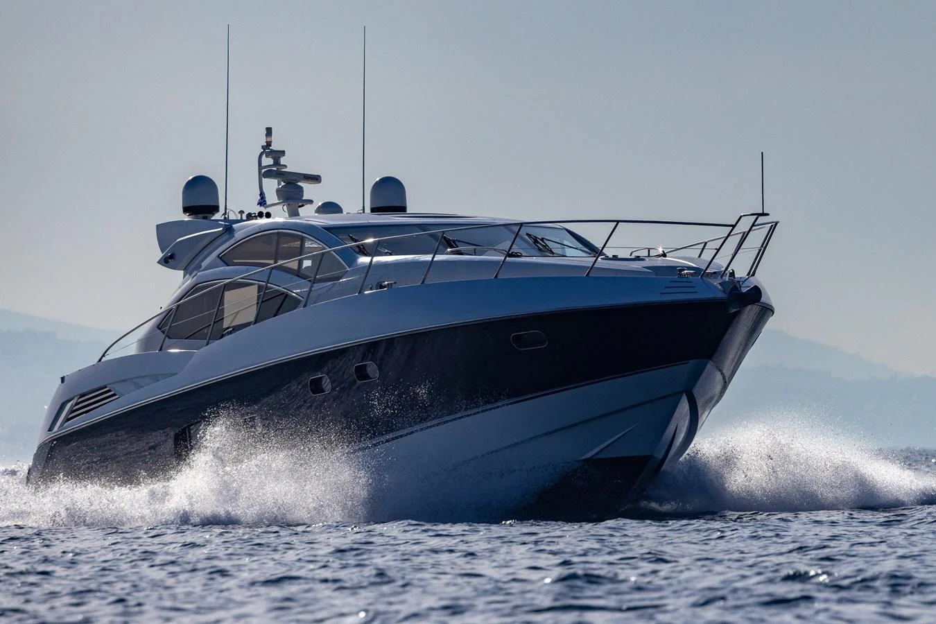 A sleek and modern yacht cruises swiftly through the water, showcasing its elegant design and powerful performance. aboard M/Y MIEL Yacht for Sale