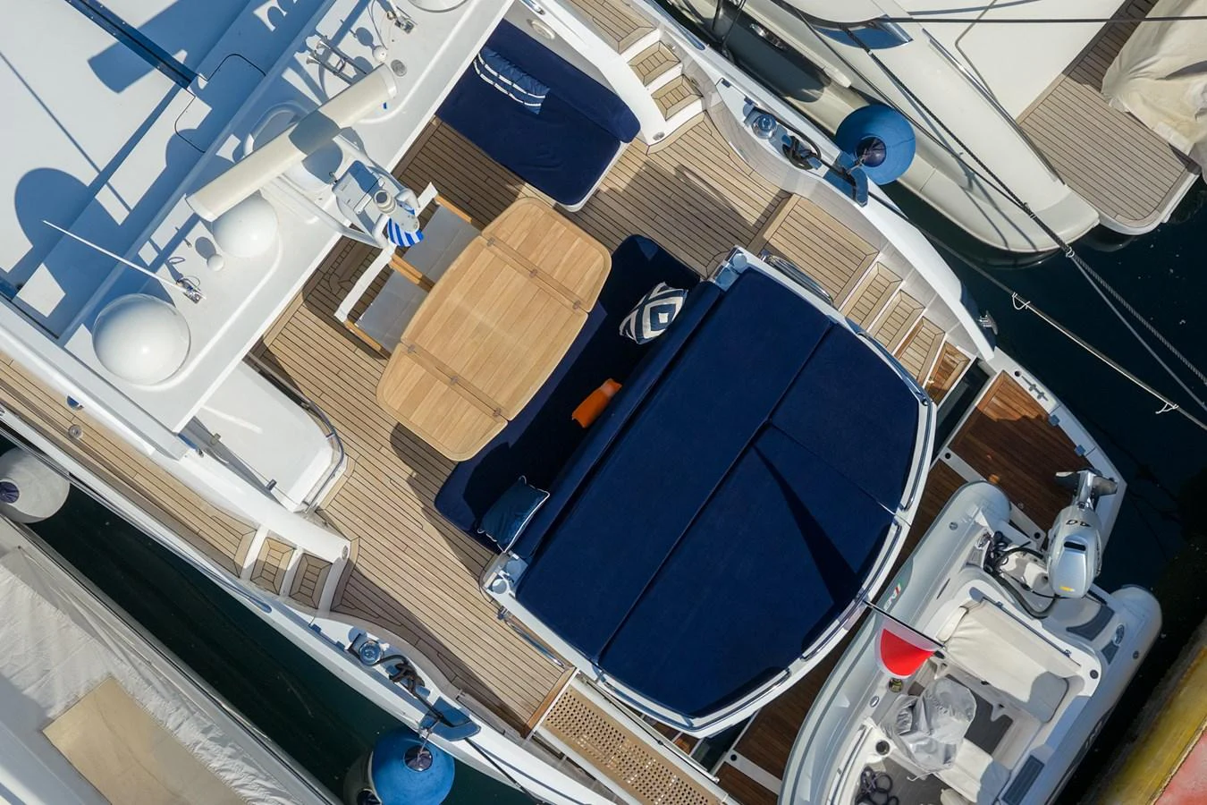 The aft deck features a spacious lounging area with comfortable seating and a dining table, perfect for outdoor relaxation. aboard M/Y MIEL Yacht for Sale