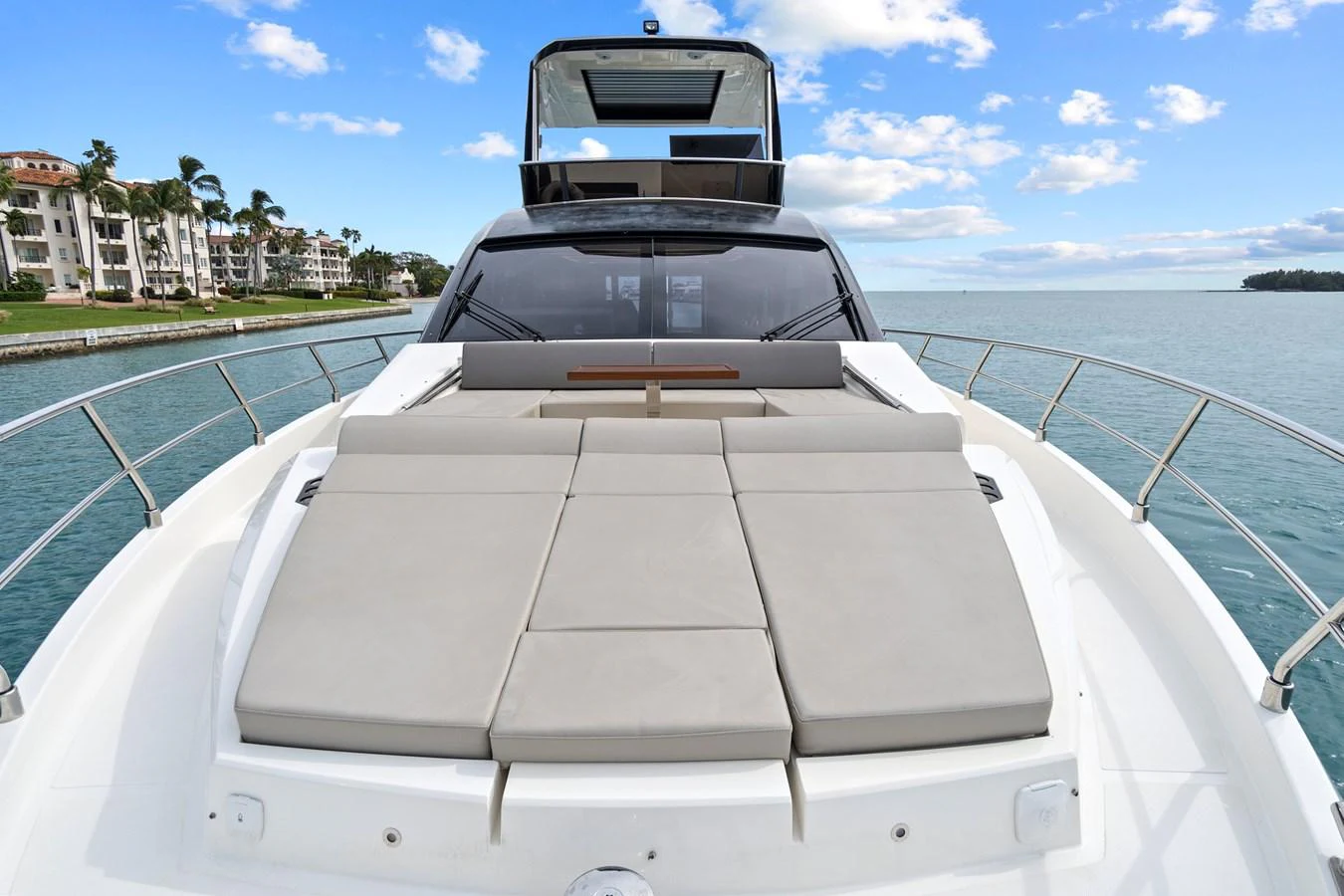 The yacht's foredeck features luxurious sun pads with a stunning view of the surrounding waters. aboard JESSEA Yacht for Sale