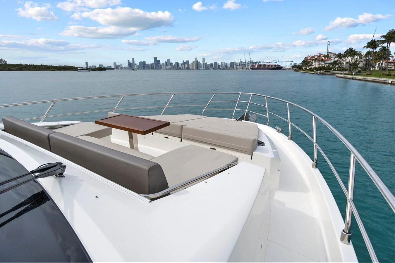 The foredeck features spacious sun pads and a small table, perfect for relaxing while enjoying the view. aboard JESSEA Yacht for Sale