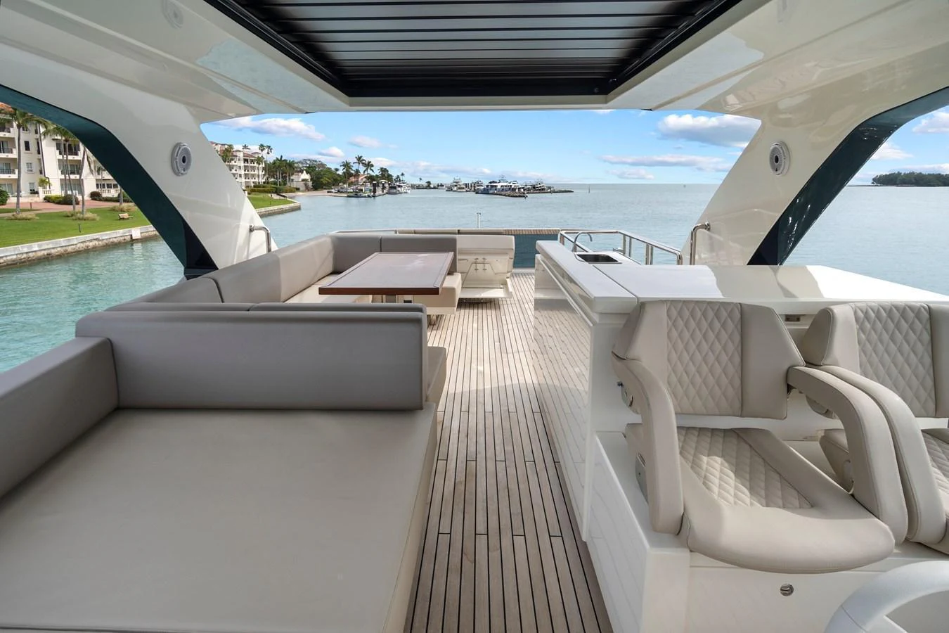 The flybridge offers a spacious and luxurious outdoor seating area with stunning views of the water. aboard JESSEA Yacht for Sale