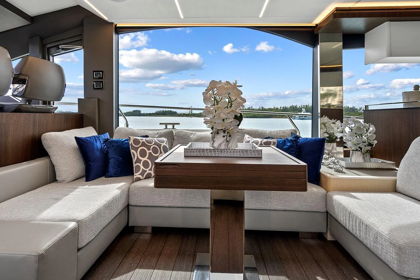 The salon offers a luxurious and comfortable space with plush seating and a stunning view of the water. aboard JESSEA Yacht for Sale