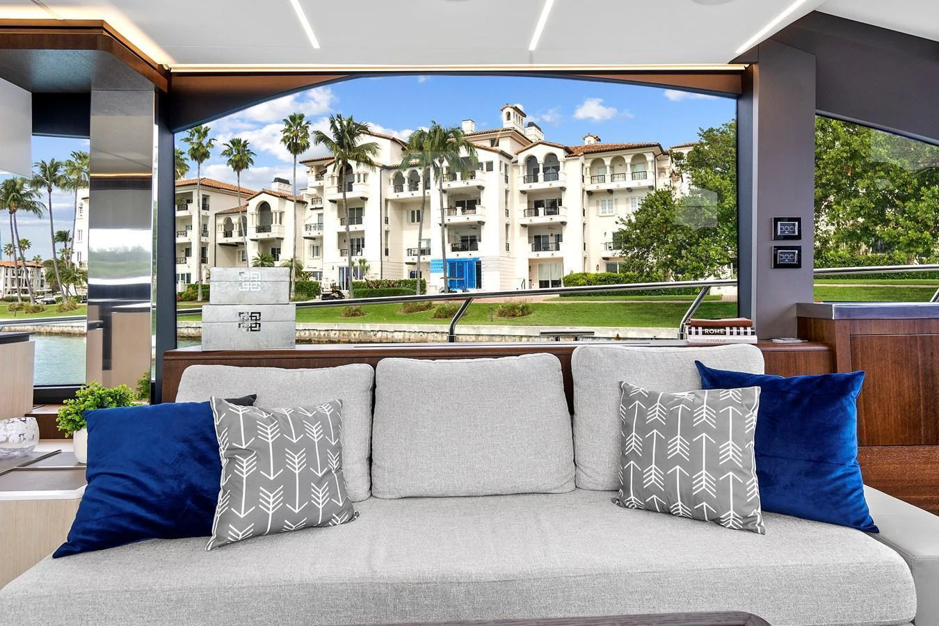 The yacht's salon offers a comfortable seating area with a scenic view of the waterfront. aboard JESSEA Yacht for Sale