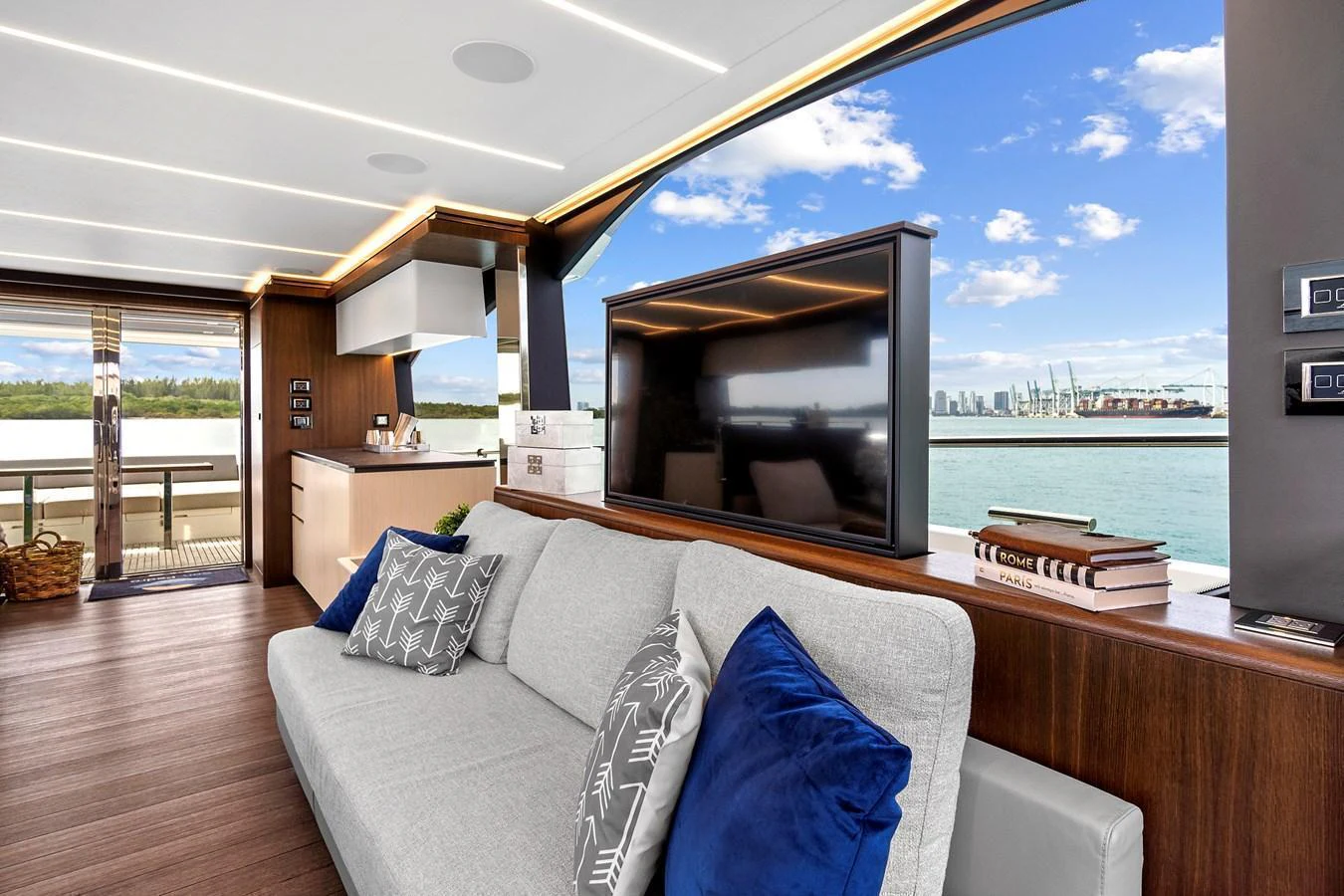 The salon offers a luxurious and comfortable space with large windows providing stunning views of the water. aboard JESSEA Yacht for Sale