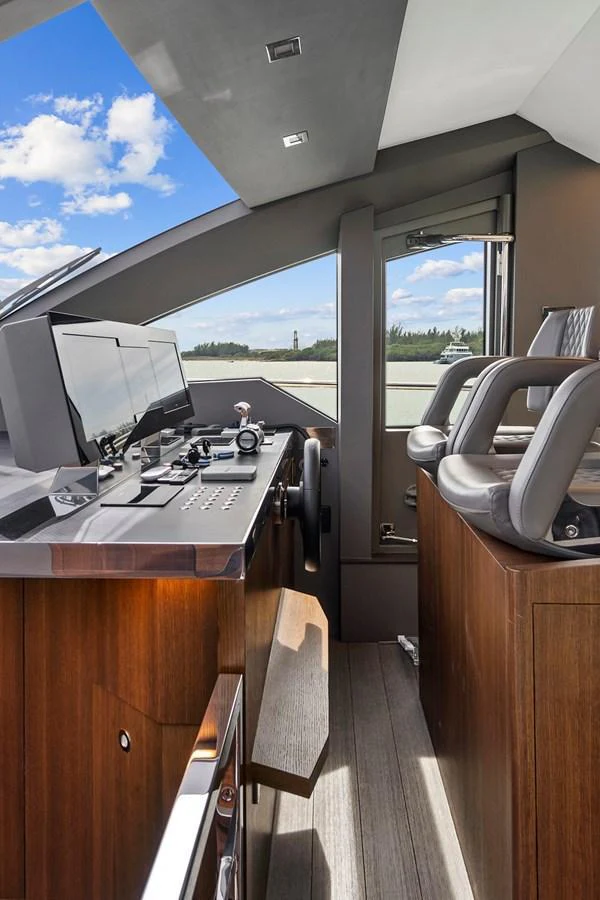 The helm station features modern navigation equipment and luxurious seating, offering a commanding view for the captain. aboard JESSEA Yacht for Sale