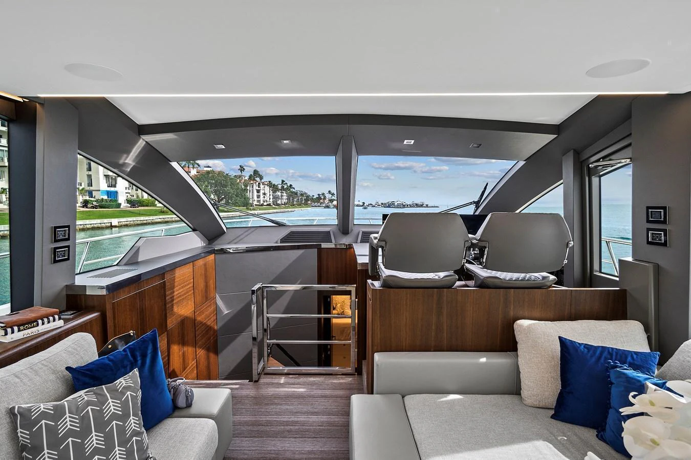 The salon offers a luxurious and spacious area with modern furnishings and expansive windows for stunning views. aboard JESSEA Yacht for Sale