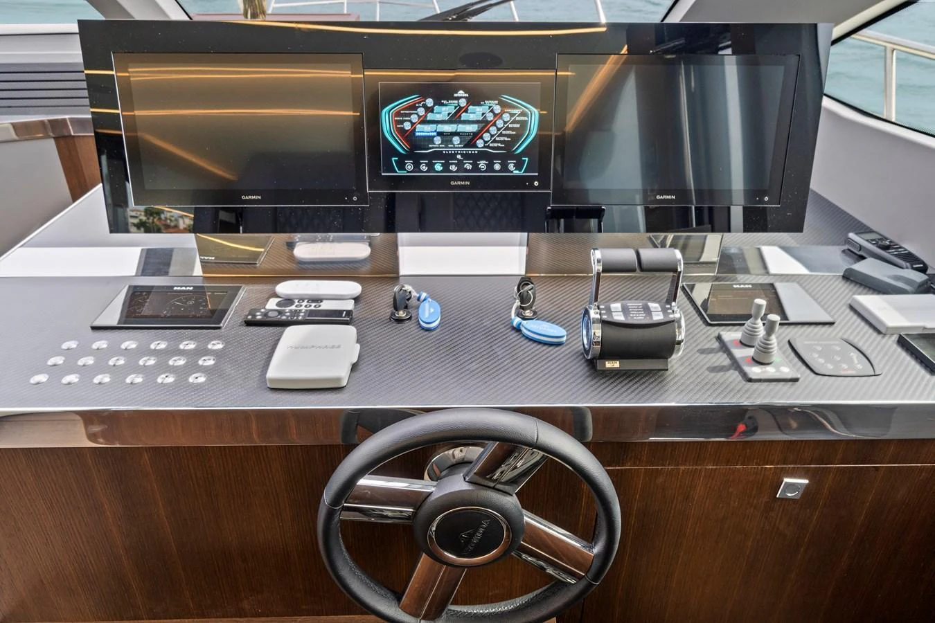 The helm features advanced navigation systems and a sleek, modern design. aboard JESSEA Yacht for Sale