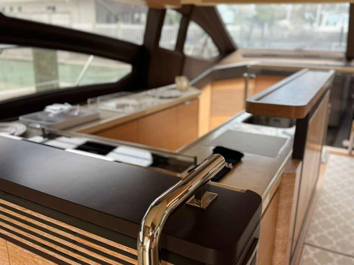 The yacht's galley features modern design with sleek countertops and ample natural light. aboard TARKAN Yacht for Sale