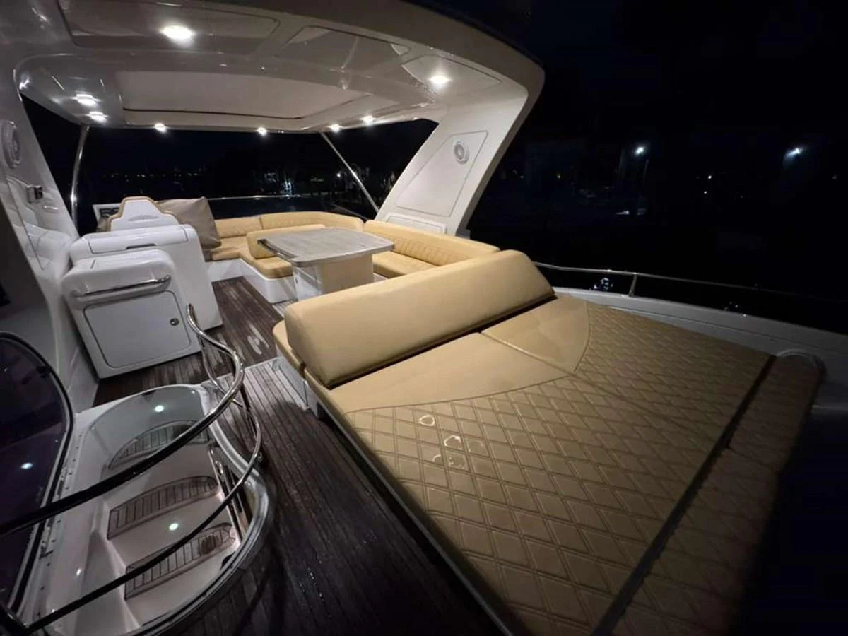 The aft deck features luxurious seating and a stylish table, perfect for evening relaxation. aboard TARKAN Yacht for Sale