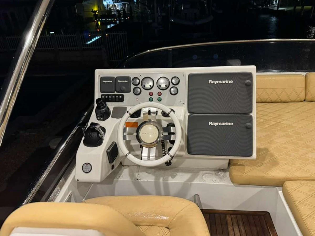 The helm station features advanced navigation equipment and a comfortable seating area. aboard TARKAN Yacht for Sale