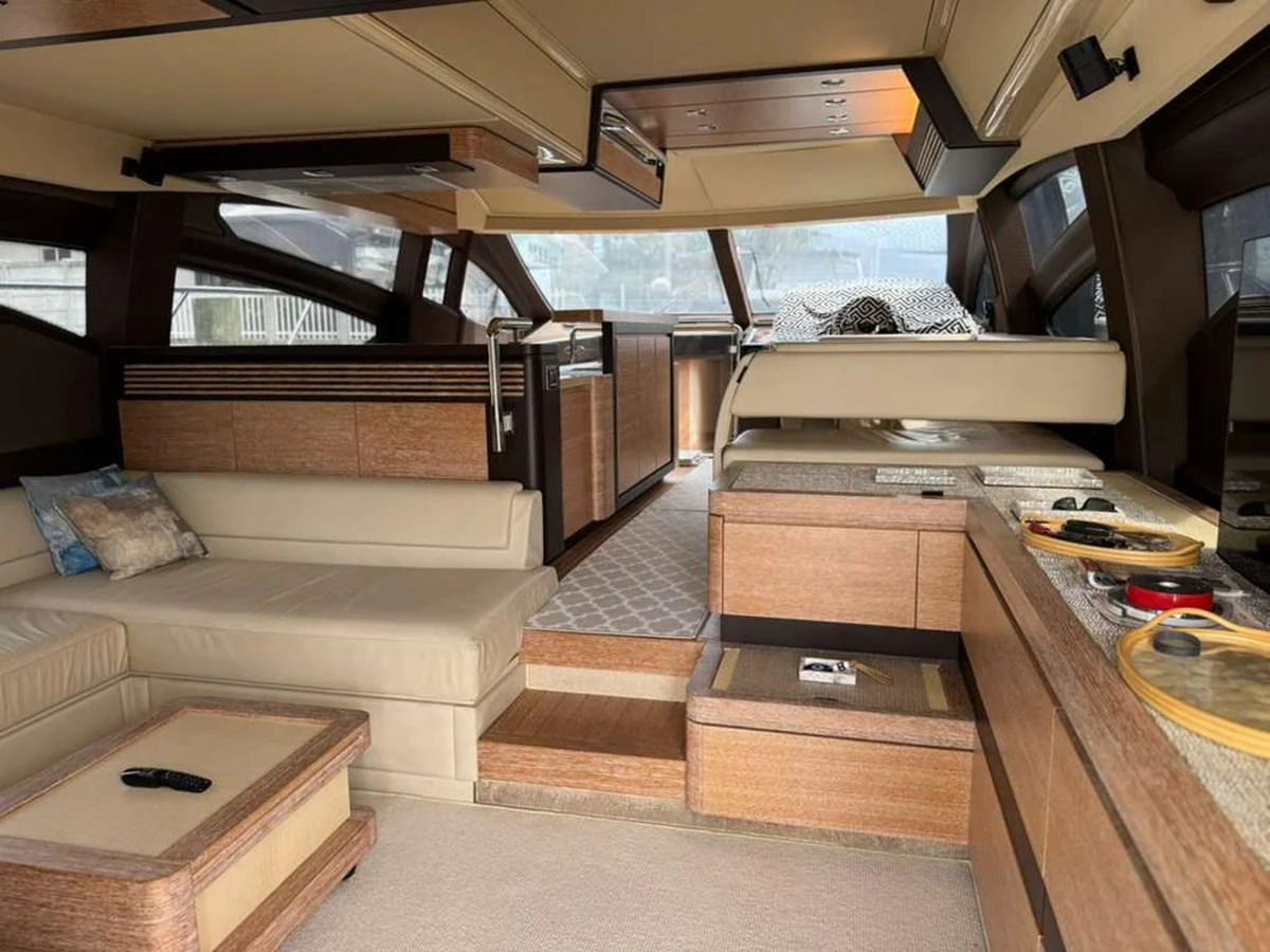 The salon features a spacious seating area with modern furnishings and ample natural light. aboard TARKAN Yacht for Sale