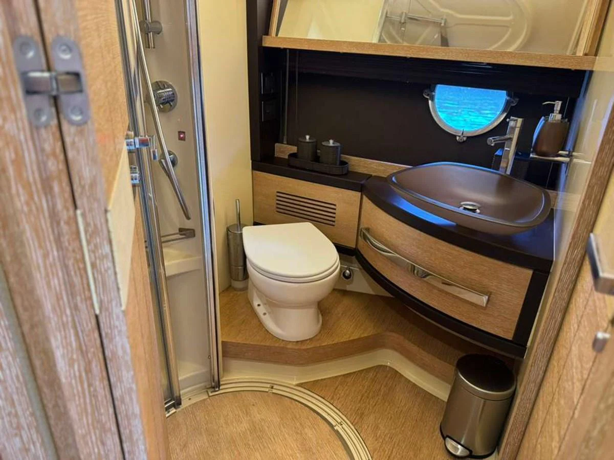 The yacht's head features modern fixtures and a compact, efficient layout. aboard TARKAN Yacht for Sale