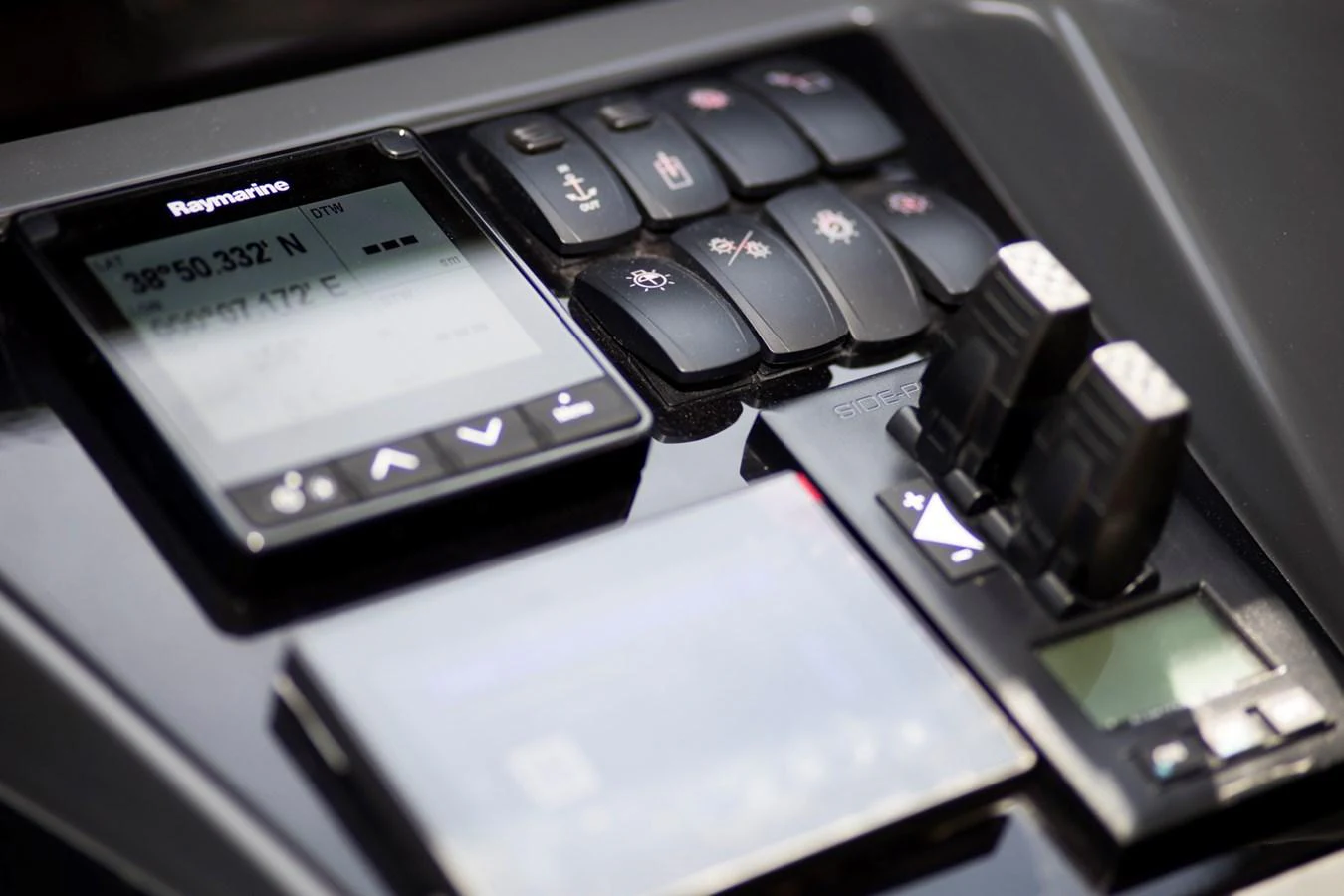 A close-up view of the yacht's navigation and control panel, showcasing advanced technology. aboard BK ONE Yacht for Sale