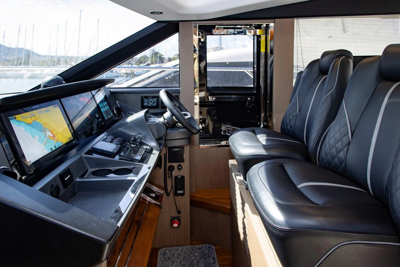 The helm station features advanced navigation equipment and comfortable seating. aboard BK ONE Yacht for Sale