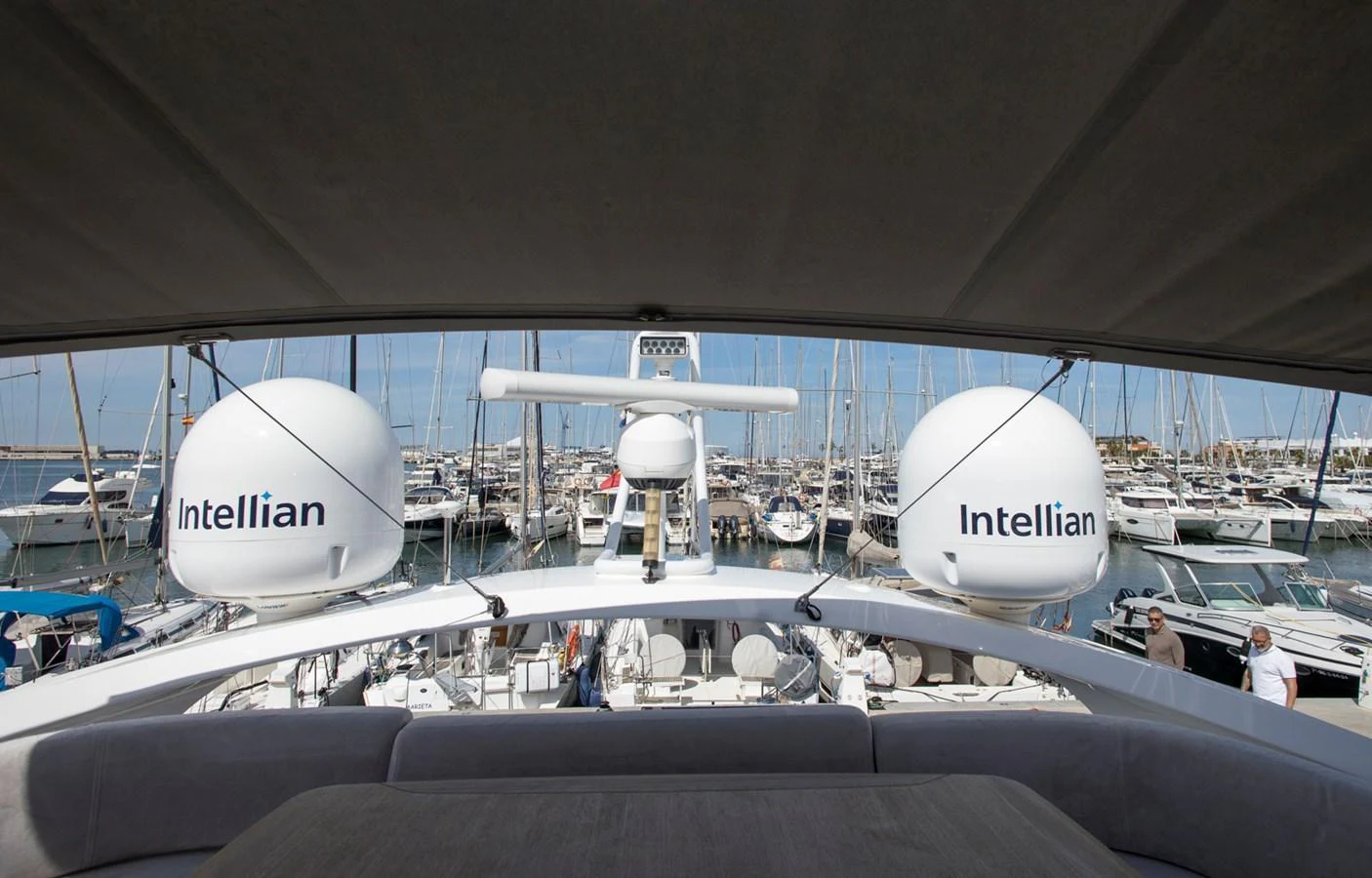 The image showcases the advanced satellite communication equipment on the yacht, with a marina in the background. aboard BK ONE Yacht for Sale