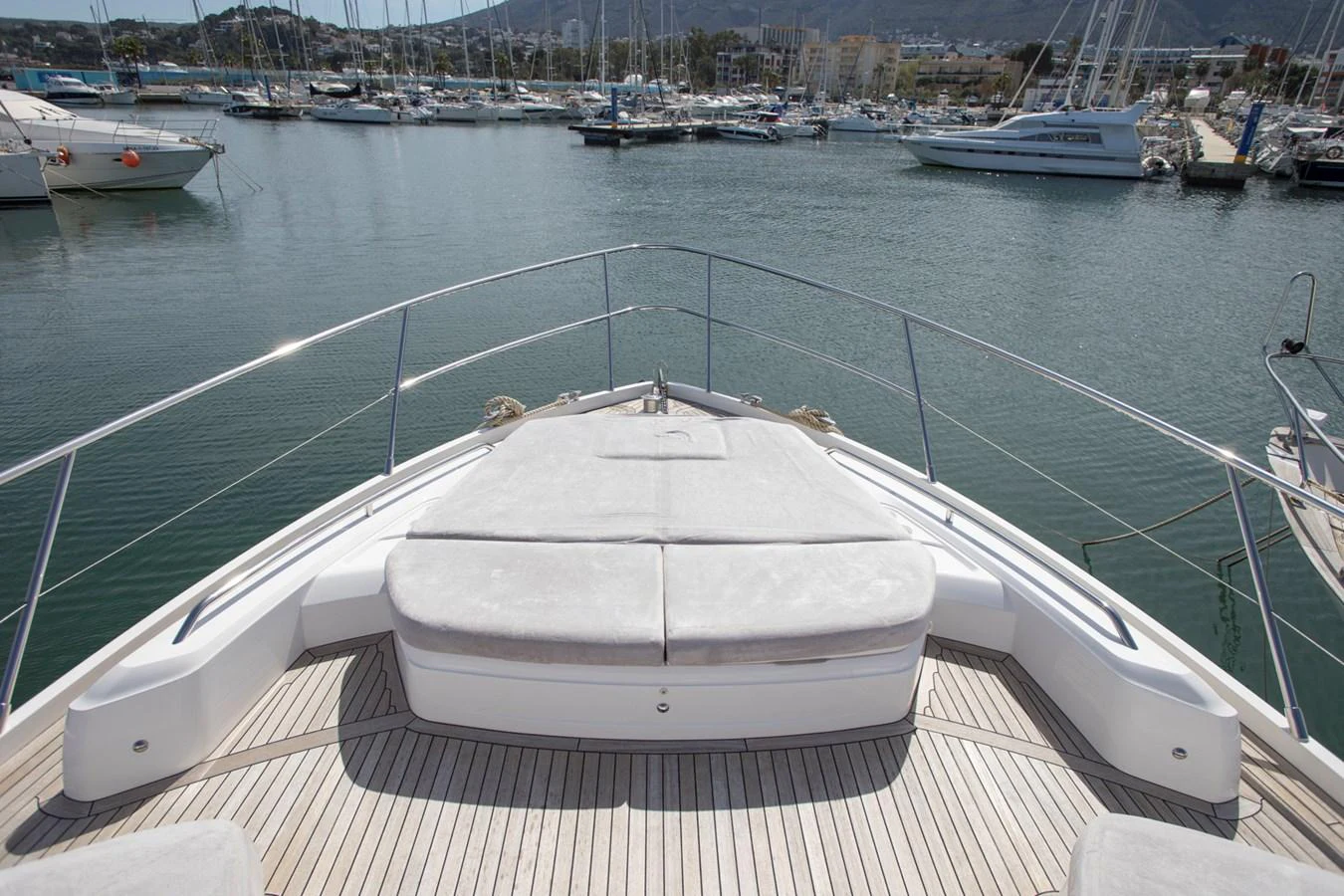 The yacht's foredeck features a spacious sunbathing area with plush cushions, perfect for relaxation. aboard BK ONE Yacht for Sale