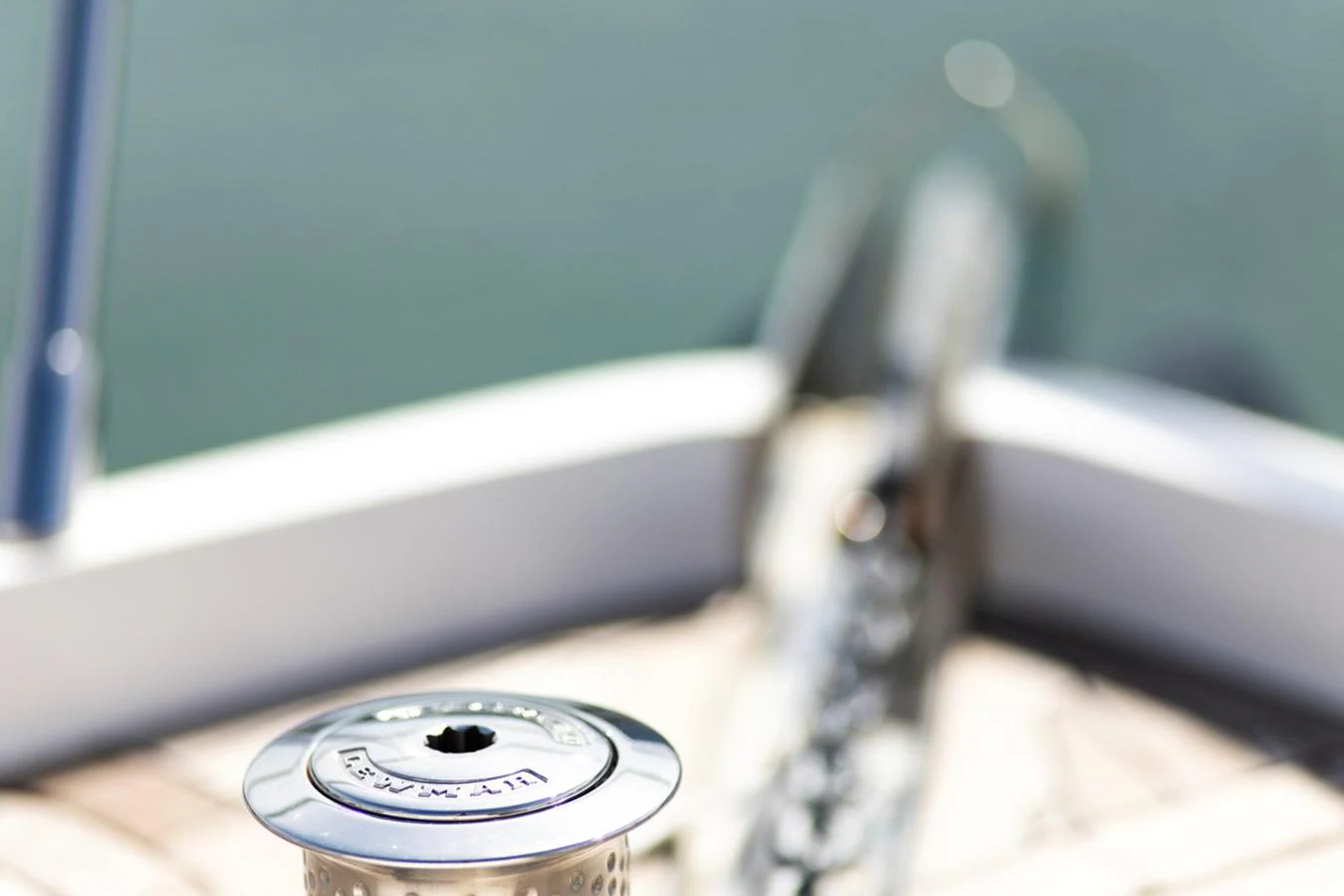 A close-up of a yacht's anchor windlass on the deck, showcasing its polished metal finish. aboard BK ONE Yacht for Sale