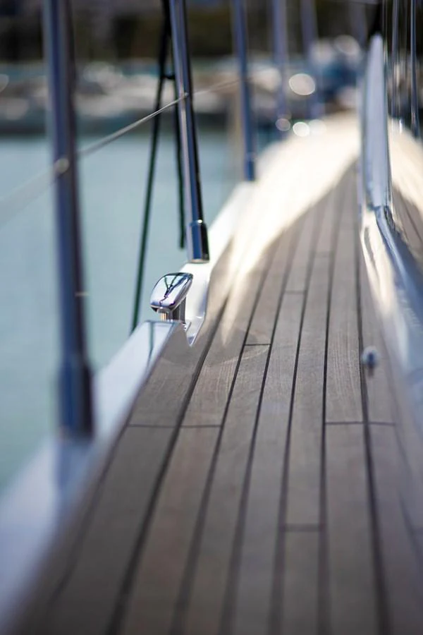 A close-up view of the yacht's sleek teak deck, showcasing its polished finish and elegant design. aboard BK ONE Yacht for Sale