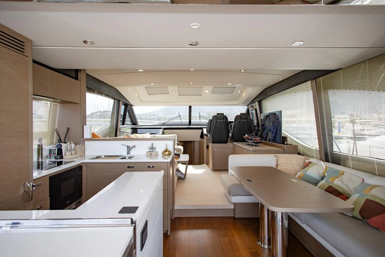 The yacht's salon features a modern and spacious layout with ample seating and a well-equipped galley. aboard BK ONE Yacht for Sale