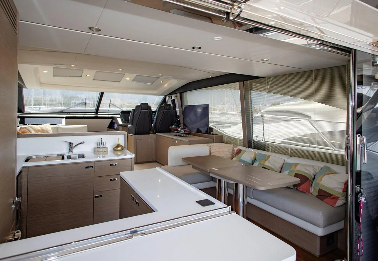 The salon features a modern and spacious layout with comfortable seating and a well-equipped galley. aboard BK ONE Yacht for Sale