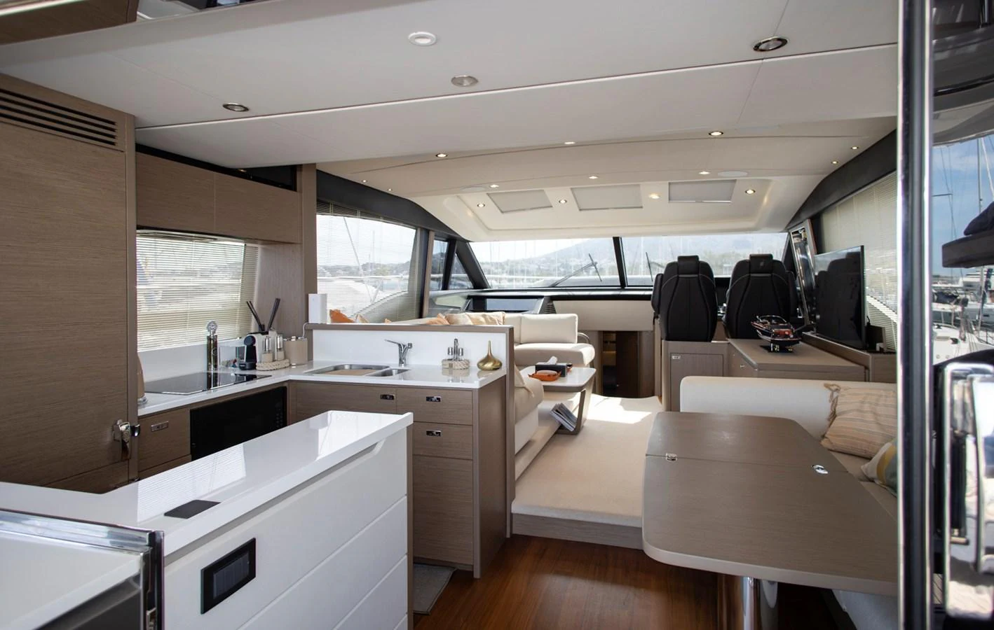 The salon features a modern and spacious design with ample natural light and luxurious furnishings. aboard BK ONE Yacht for Sale
