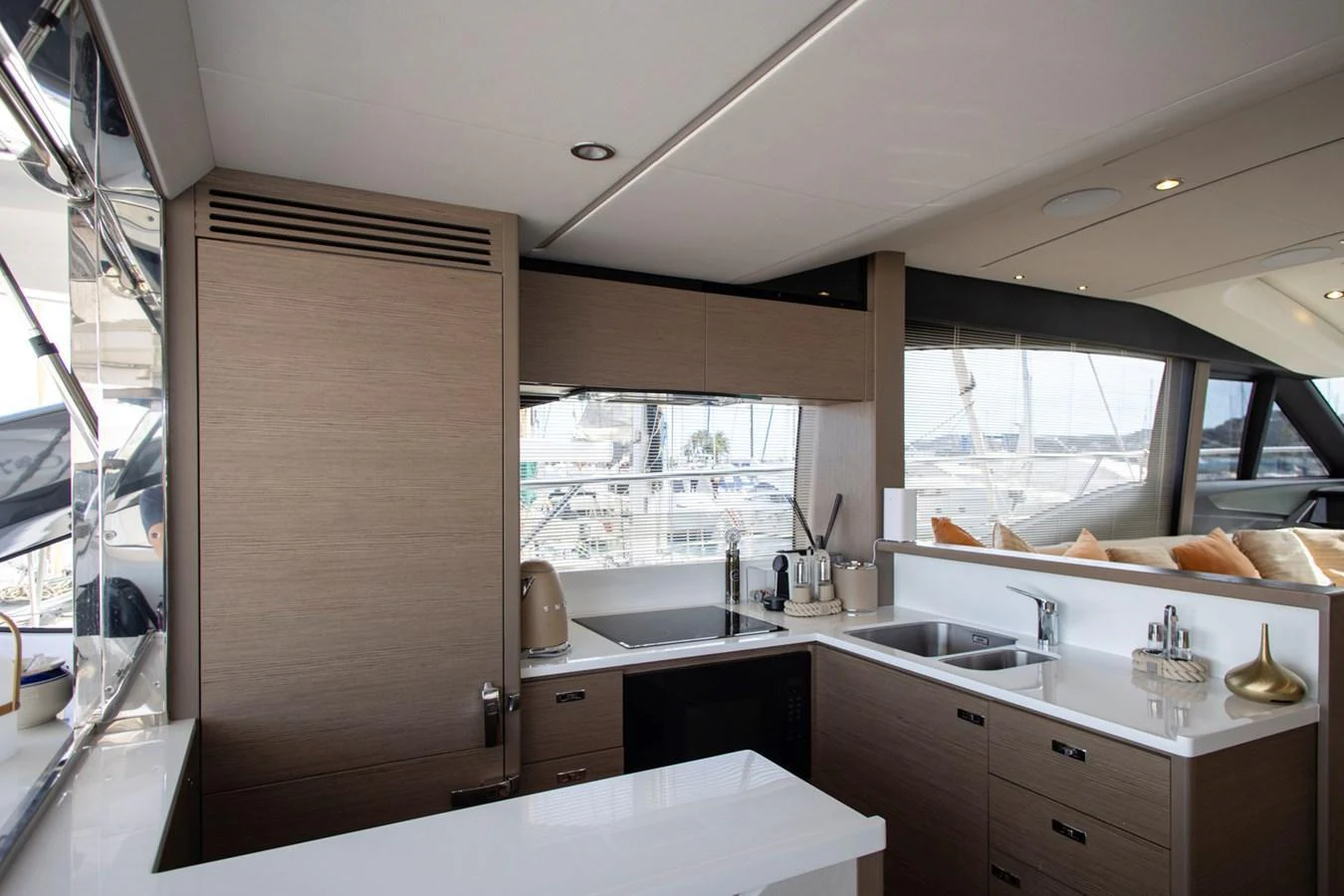 The yacht's galley is modern and well-equipped, featuring sleek cabinetry and ample counter space. aboard BK ONE Yacht for Sale