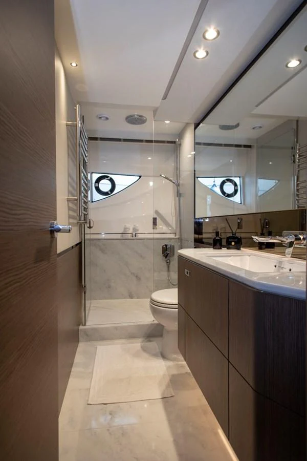 A modern yacht bathroom with sleek fixtures and a spacious shower area. aboard BK ONE Yacht for Sale