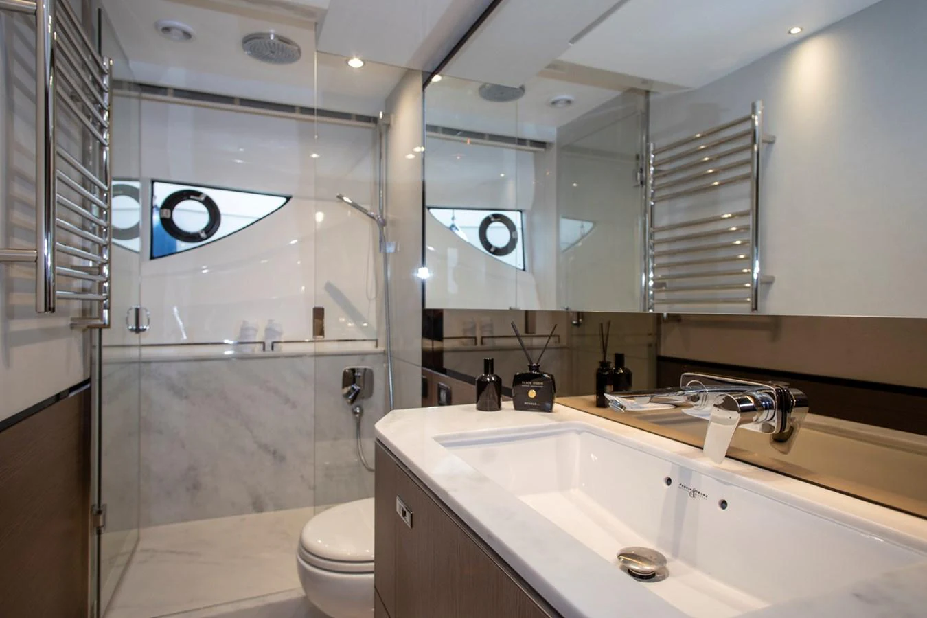 The yacht's bathroom features modern fixtures and a sleek design with ample lighting. aboard BK ONE Yacht for Sale