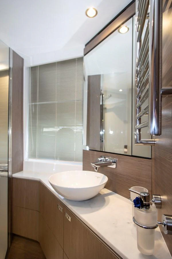 The yacht's bathroom features modern fixtures and a sleek design. aboard BK ONE Yacht for Sale