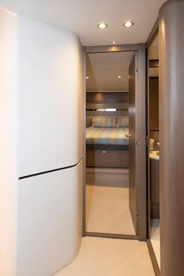 A cozy stateroom with a comfortable bed and modern lighting. aboard BK ONE Yacht for Sale