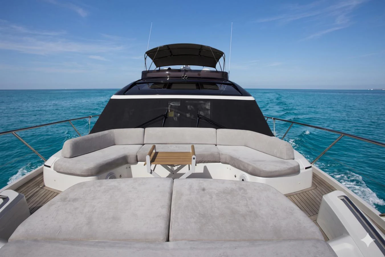 The bow of the yacht features a luxurious seating area with plush cushions, perfect for enjoying the open sea. aboard BK ONE Yacht for Sale