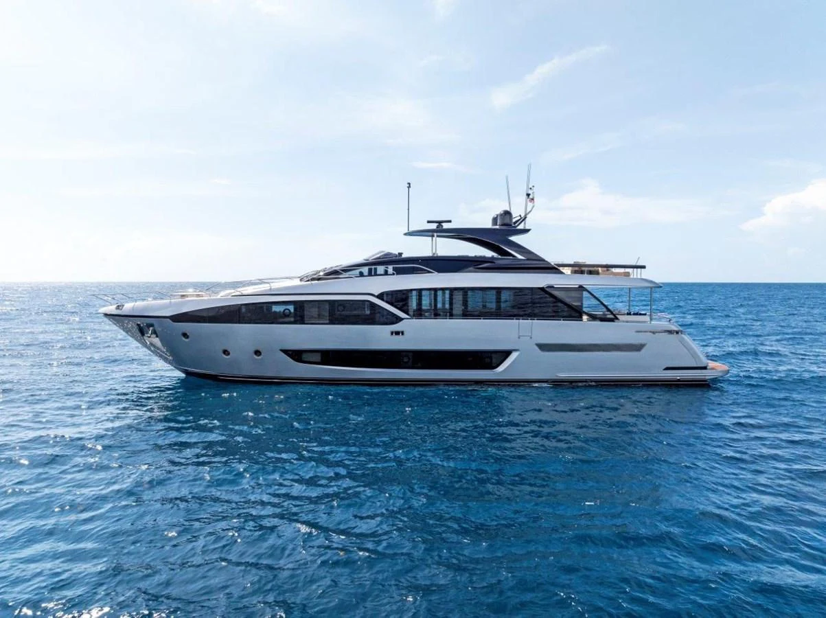 A sleek and modern yacht cruising on the open sea under a clear blue sky. aboard MSEA Yacht for Sale