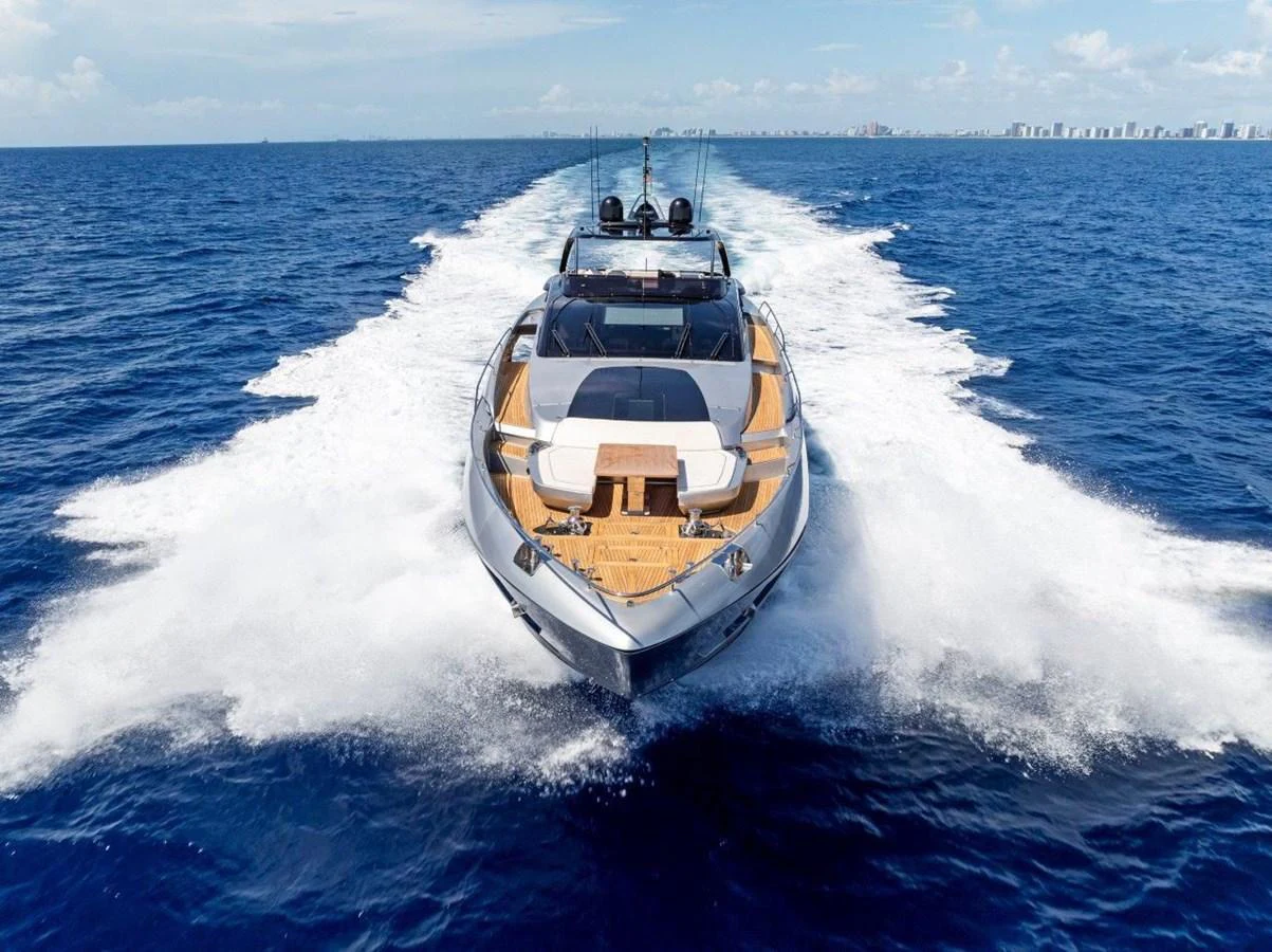 A sleek yacht cuts through the open sea, showcasing its powerful design and luxurious deck space. aboard MSEA Yacht for Sale