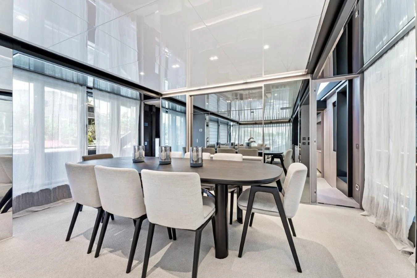 The yacht's dining area features a sleek, modern design with ample seating and elegant decor. aboard MSEA Yacht for Sale