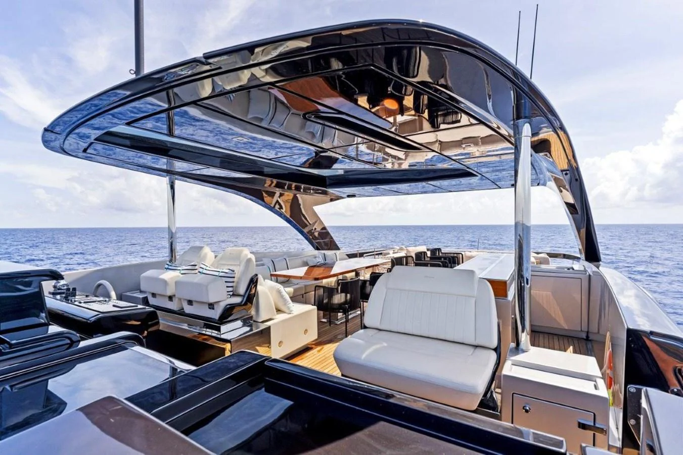 The flybridge offers a luxurious outdoor seating area with panoramic ocean views. aboard MSEA Yacht for Sale