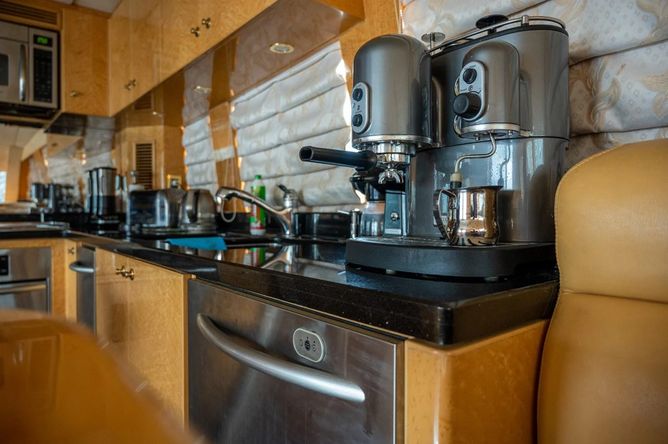 The galley is equipped with modern appliances, including a sleek coffee machine, ensuring a comfortable and luxurious experience. aboard LADY EILEEN Yacht for Sale