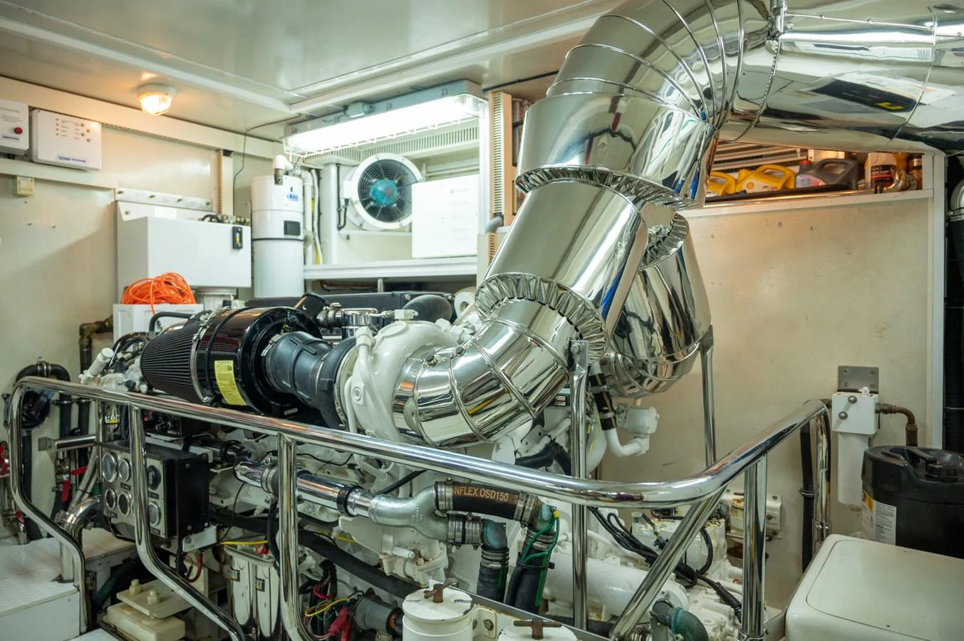 The image showcases the yacht's well-maintained engine room with polished metal components. aboard LADY EILEEN Yacht for Sale