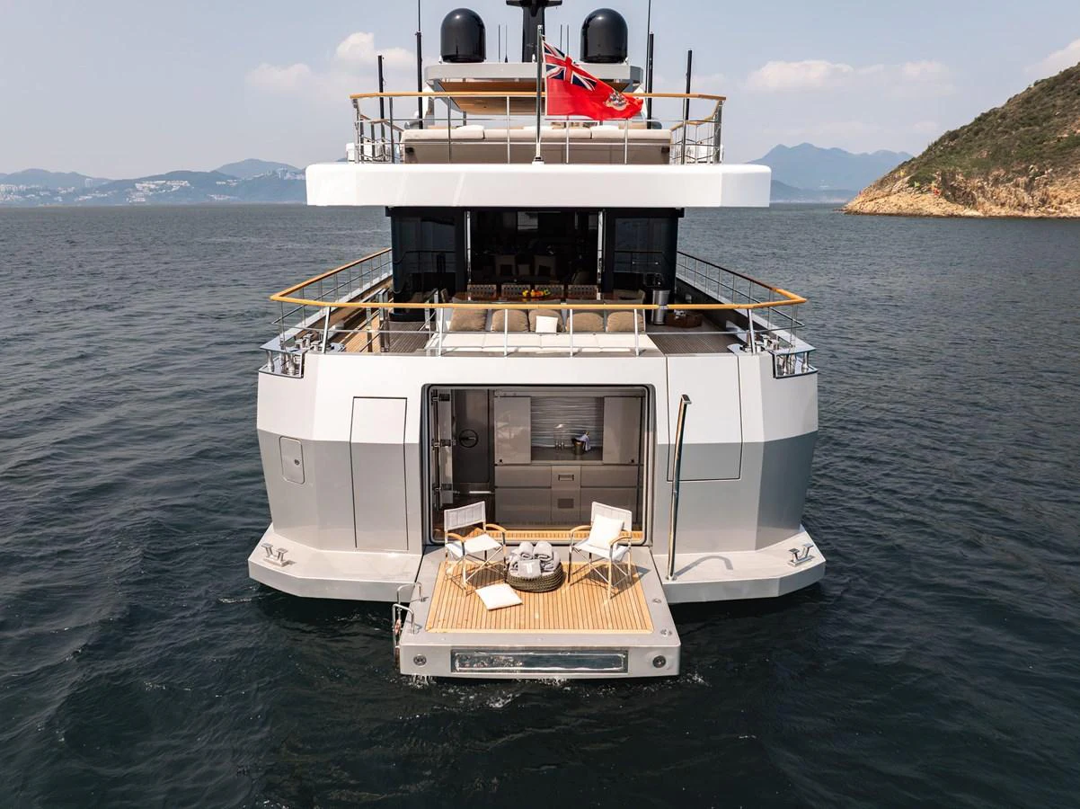 The yacht's aft deck features a cozy seating area with a stunning view of the surrounding waters. aboard SUN PRINCE Yacht for Sale
