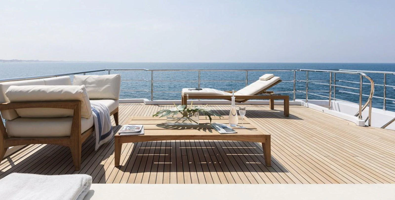 The sundeck offers a serene space with luxurious loungers and a stunning ocean view. aboard PANTERA Yacht for Sale