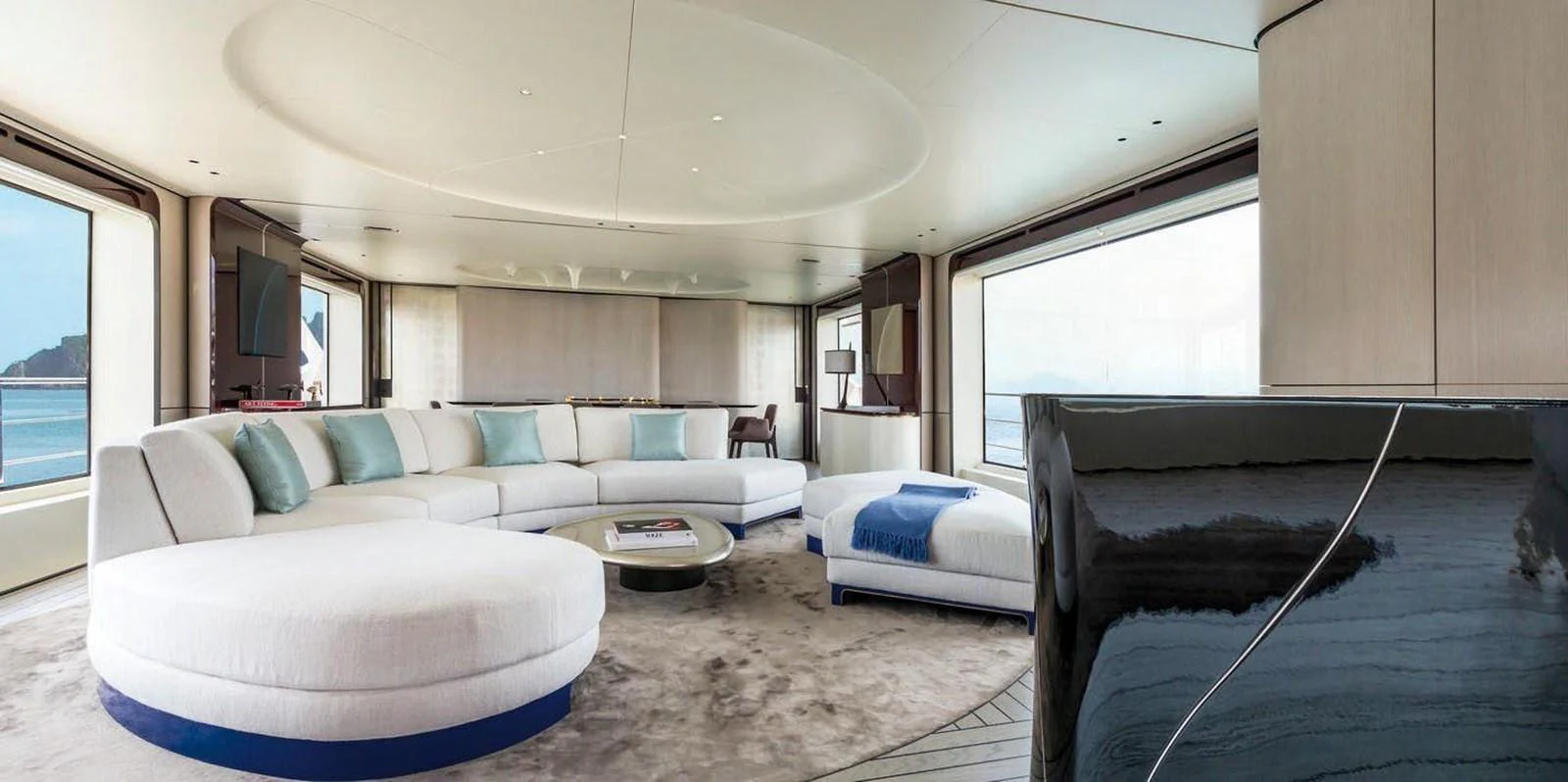 The salon offers a spacious and luxurious seating area with panoramic ocean views. aboard PANTERA Yacht for Sale