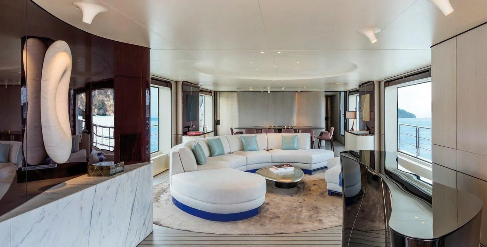 The spacious salon features modern furnishings and large windows offering panoramic ocean views. aboard PANTERA Yacht for Sale