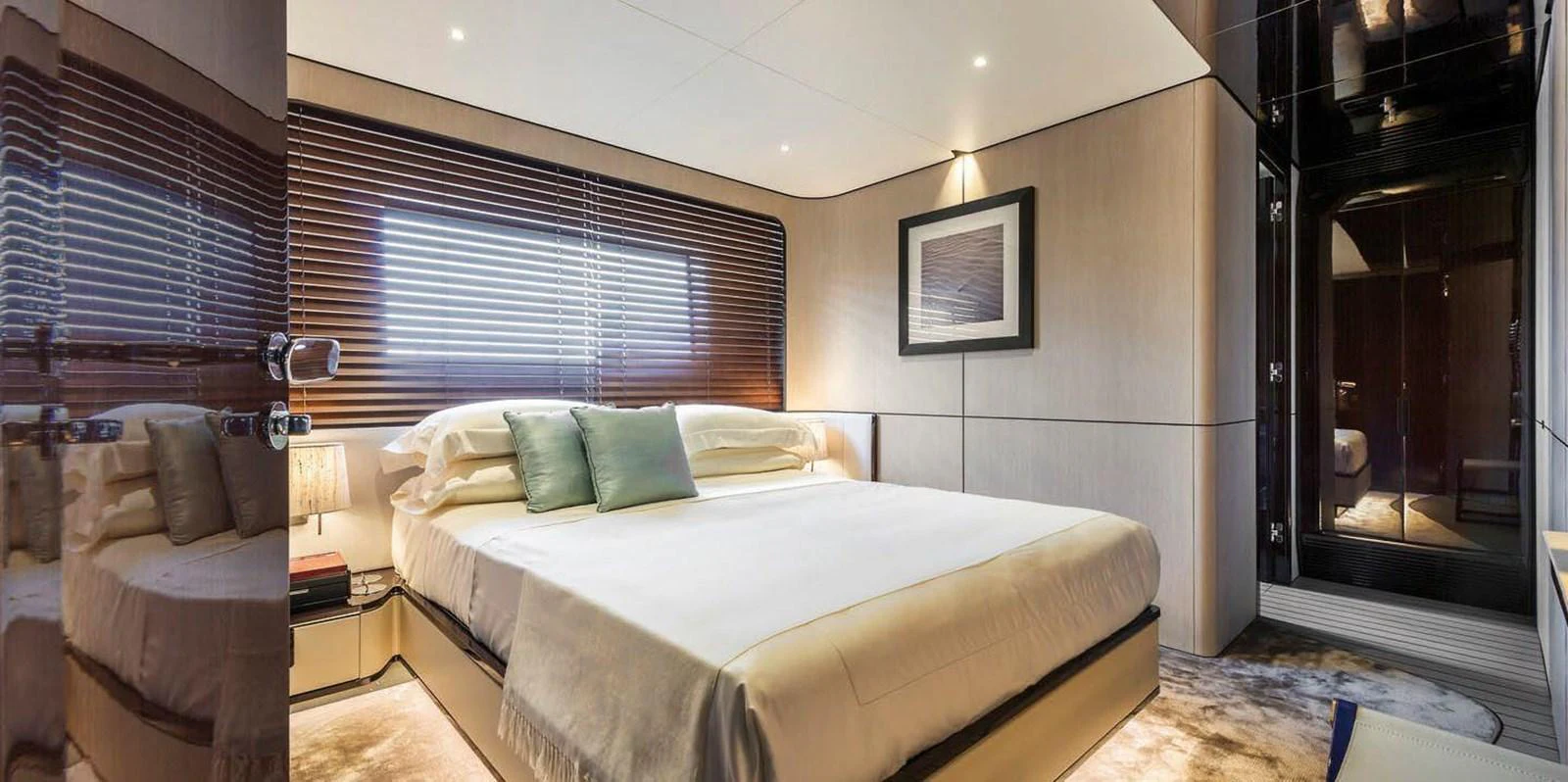 The stateroom features a luxurious bed with elegant decor and ample natural light. aboard PANTERA Yacht for Sale