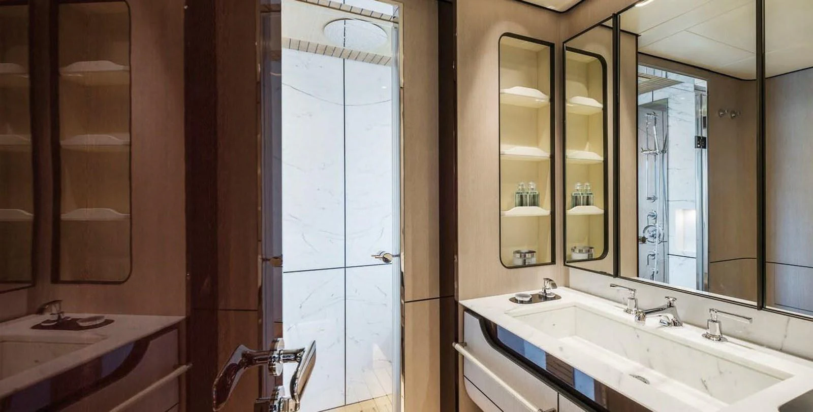 The yacht's bathroom features a luxurious double sink vanity and a spacious shower area. aboard PANTERA Yacht for Sale