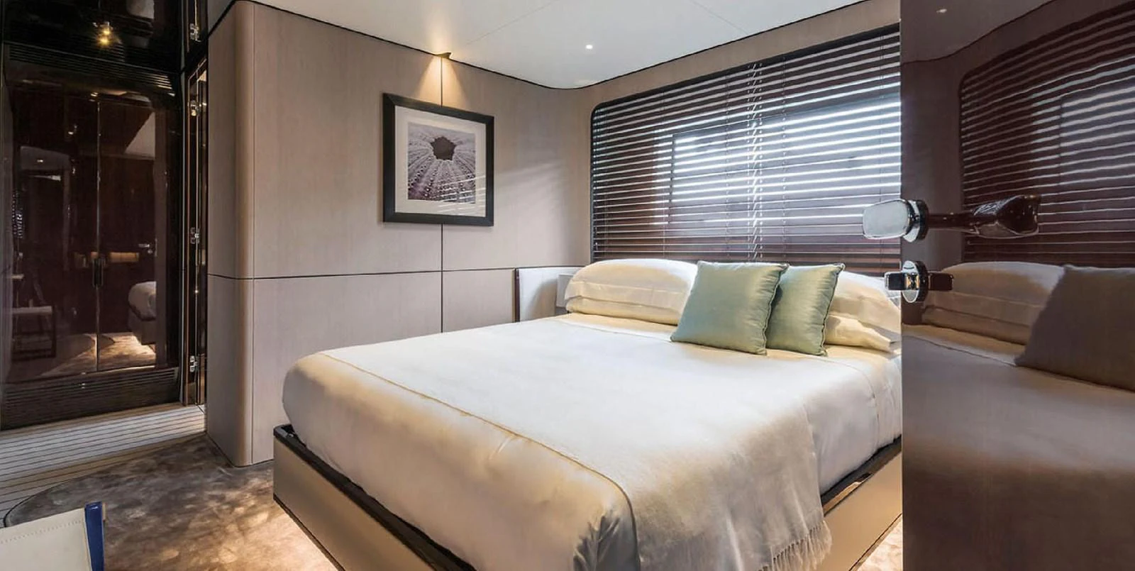 The stateroom features a luxurious bed with elegant decor and ample natural light. aboard PANTERA Yacht for Sale