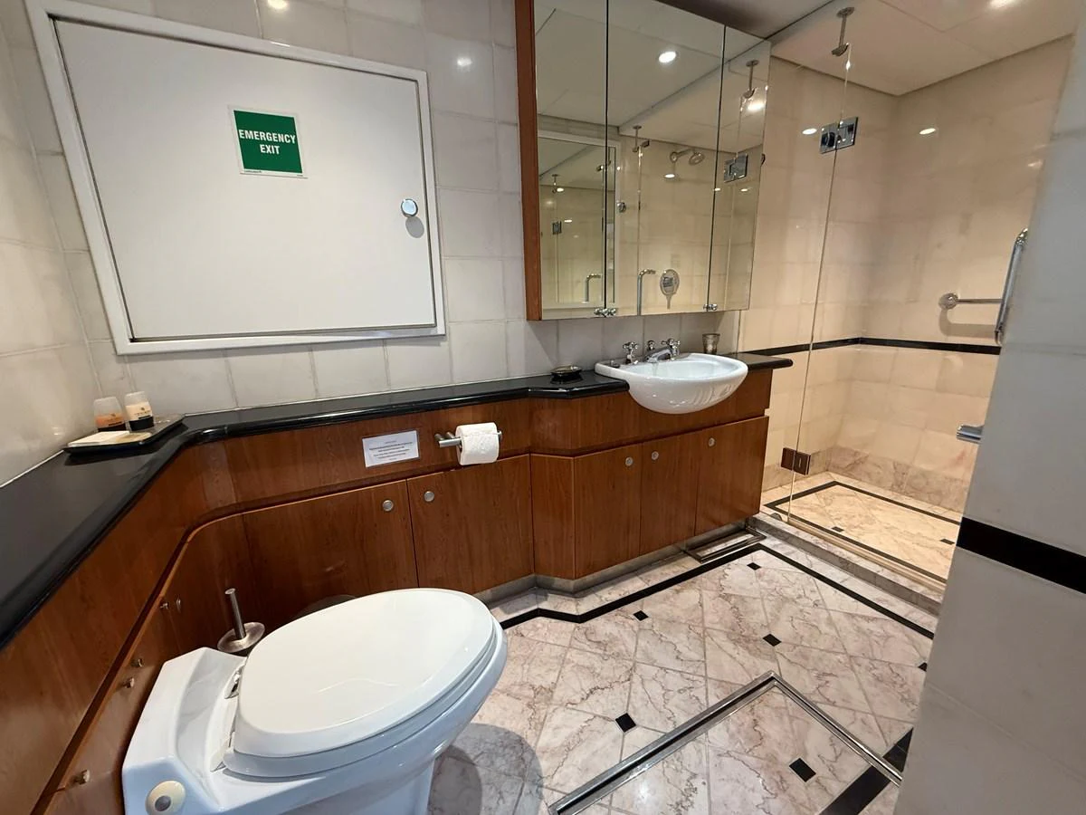 The yacht's bathroom features elegant marble flooring and modern fixtures. aboard LIGAYA Yacht for Sale