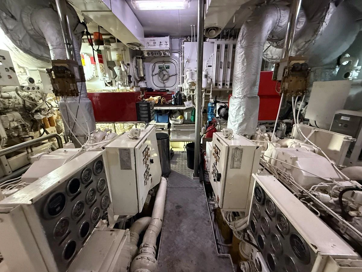 The image showcases the yacht's well-equipped engine room with various machinery and control panels. aboard LIGAYA Yacht for Sale